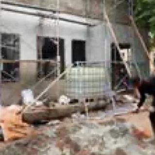 Building under renovation with materials outside