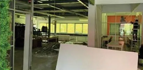 Installing glass and aluminium partitions in a factory office