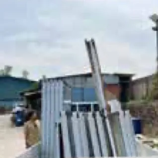 Stack of galvanized steel pipes and hollow sections on site