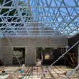 Light-steel roof truss on a brick building