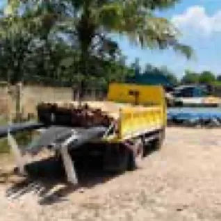 Dump truck unloading material on site
