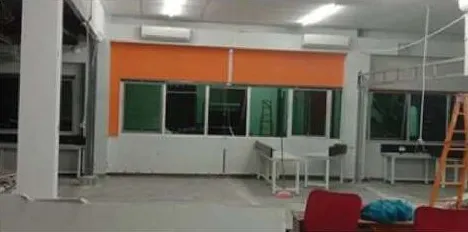 Office renovation with an orange accent wall