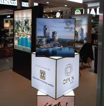 Rotating cube and tall lightbox at the exhibition booth