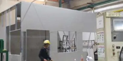 Grey panel partition room inside a factory