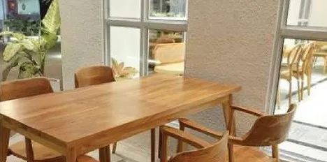 Solid-wood dining table and chairs in a café